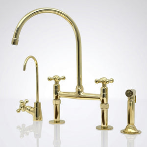 Unlacquered brass bridge kitchen faucet with Petal cross handles in a classic kitchen
