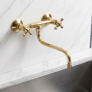 Unlacquered brass wall faucet, 10" reach, 7" drop with cross handles