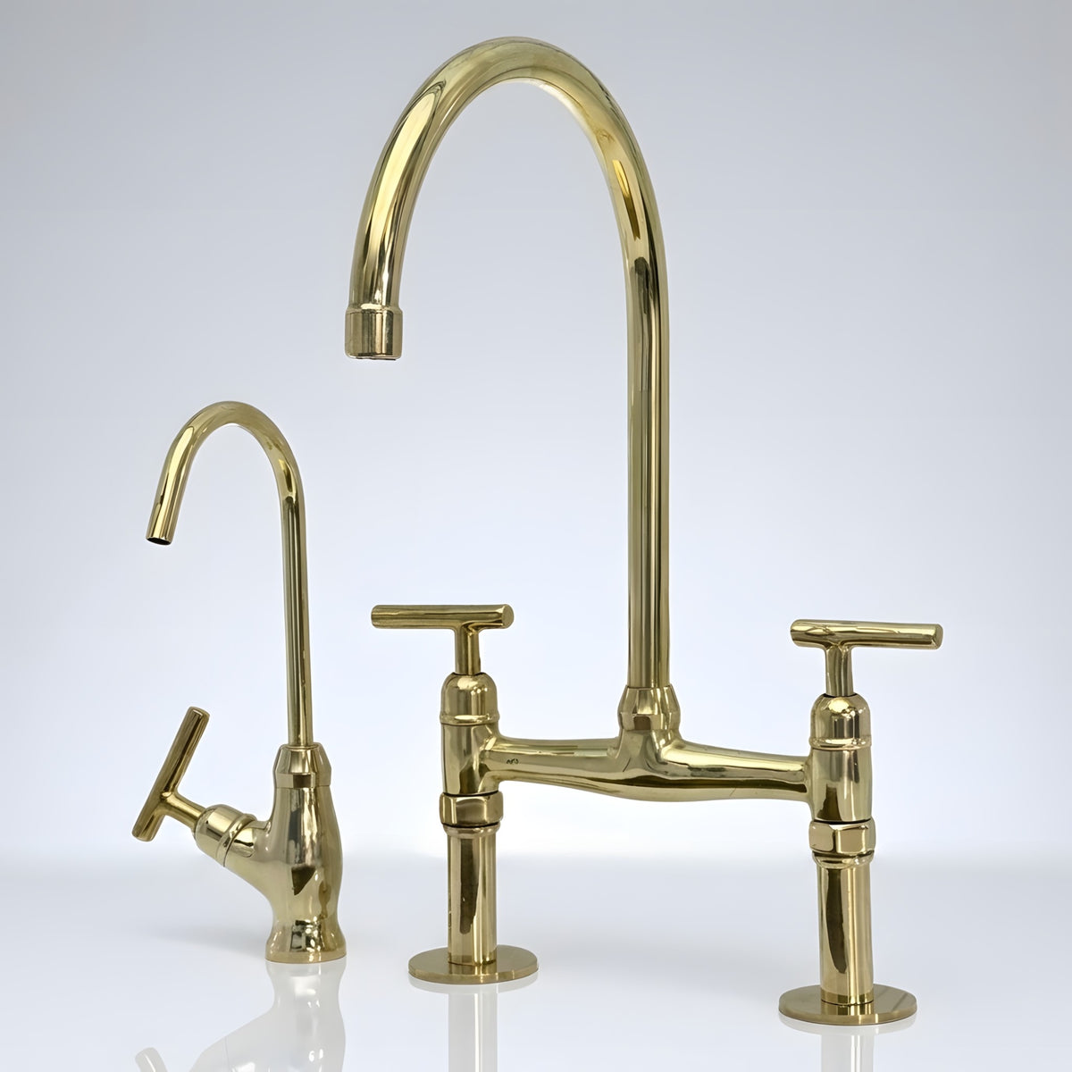 Unlacquered brass bridge kitchen faucet with drinking water tap and Reed lever handles