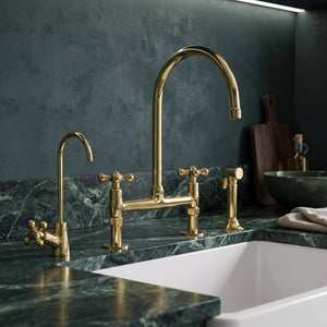 Unlacquered brass bridge kitchen faucet with Petal cross handles, side sprayer and drinking water tap