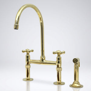 Unlacquered brass bridge kitchen faucet with side sprayer and Petal cross handles