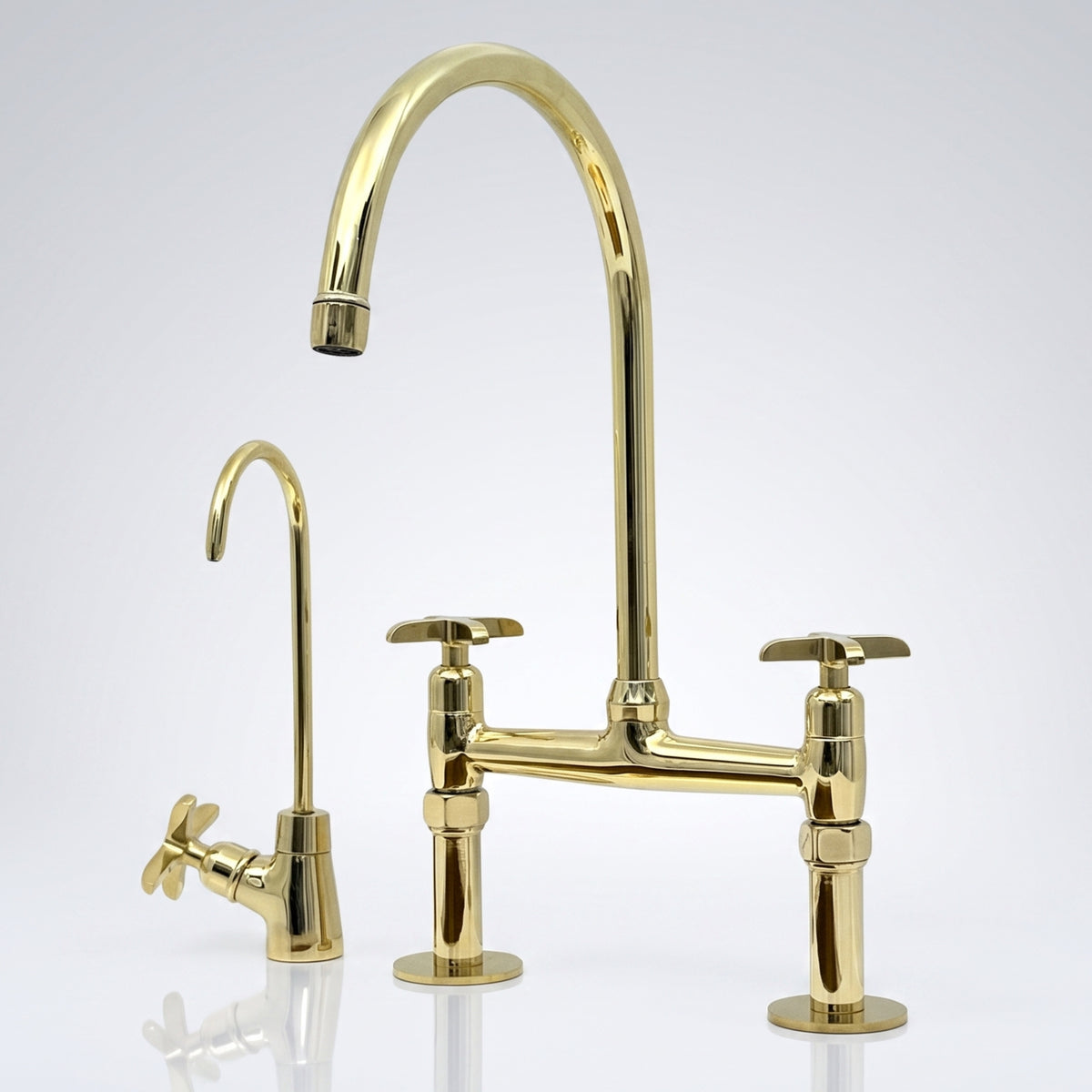 Unlacquered brass bridge kitchen faucet with cross handles and its solid brass living finish