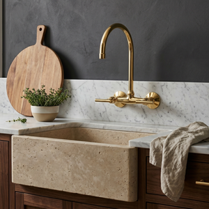 Unlacquered brass wall faucet, 11.5" high, 6" spread with lever handles