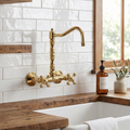 Unlacquered brass wall faucet, 10.25" high, 6" spread with cross handles